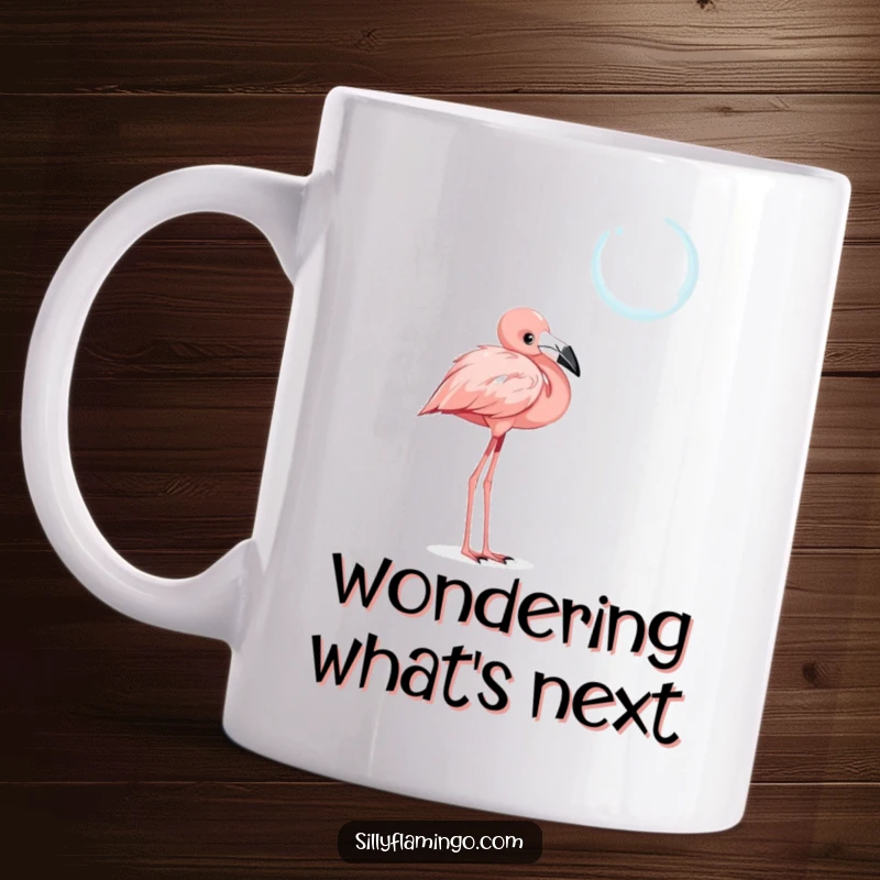 Funny mug featuring a curious flamingo with a tilted head, intently observing a shimmering, floating bubble with intrigue.