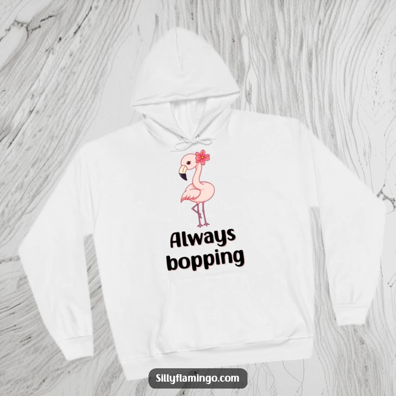 Funny flamingo hoodie featuring a happy bird with a flower, embodying warmth and gentle cheerfulness.