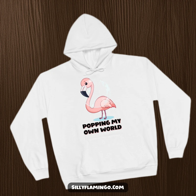 Funny Flamingo Hoodie: A cozy hoodie showing a flamingo humorously trying to inflate a large bubble.