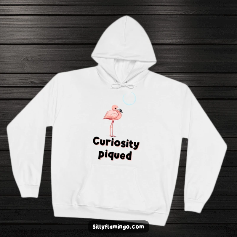 Funny hoodie featuring a curious flamingo character with a tilted head, captivated by a shimmering, floating bubble.