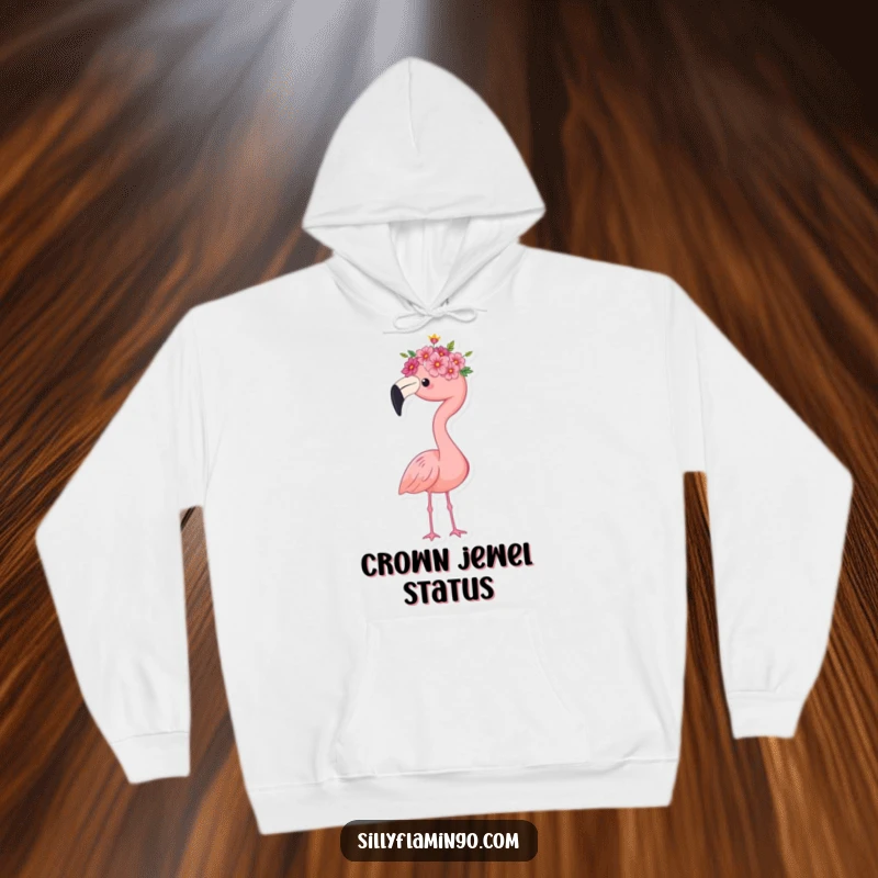 Funny flamingo hoodie, wearing a tiny flower crown, standing proudly with a regal stance, offering warmth and whimsical elegance, a great gift.