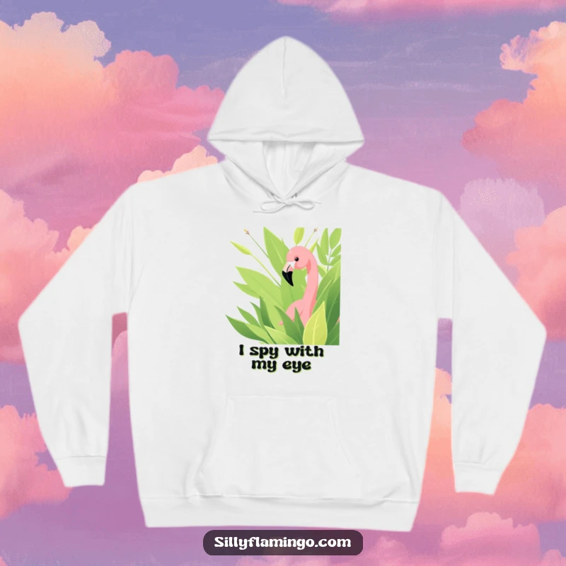 Funny hoodie showcasing a playful flamingo curiously peeking out from behind lush green leaves, offering warmth and wit.