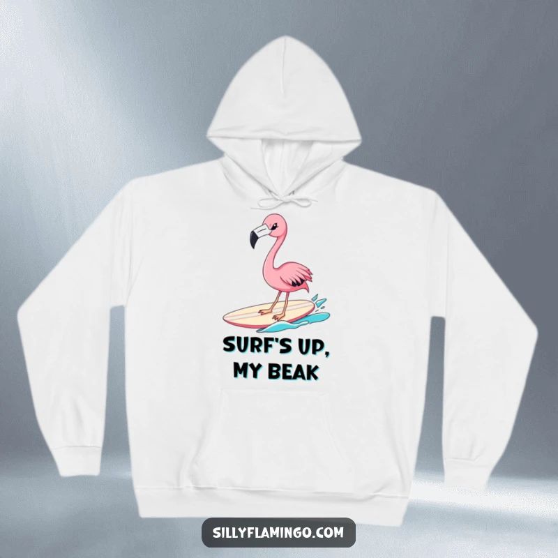 Funny flamingo hoodie showing a pink bird winking while riding a surfboard, perfect for staying warm and looking cool with a humorous touch.