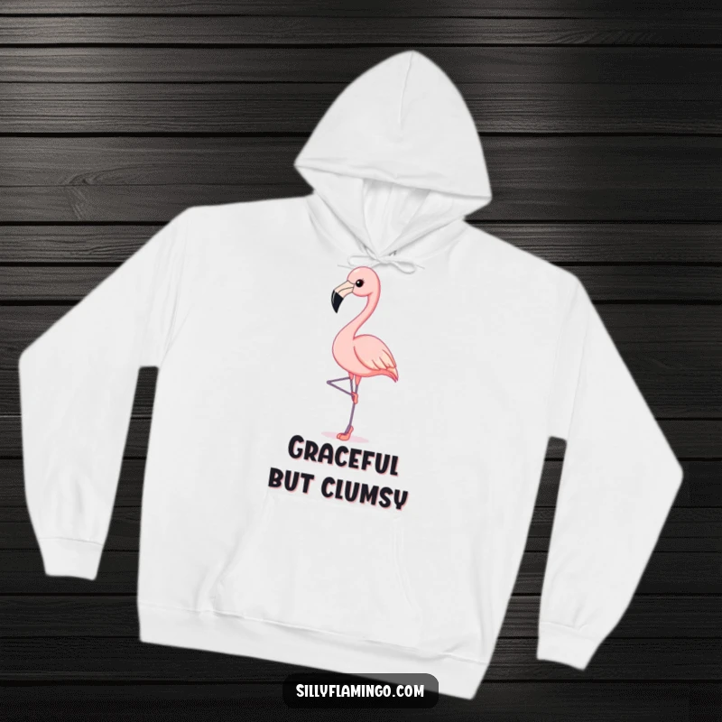 Funny Flamingo Hoodie: A flamingo elegantly poses on tiny ballet slippers, showcasing its graceful and humorous dance.