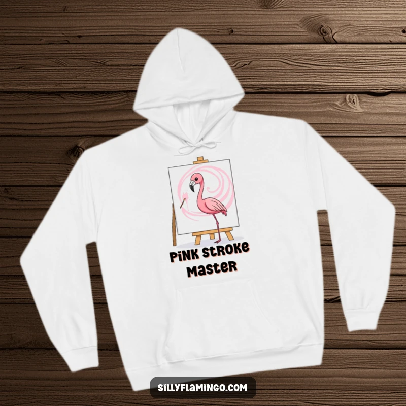 Funny hoodie depicting a flamingo artistically painting a pink swirl on a canvas, perfect for cozy creative sessions.