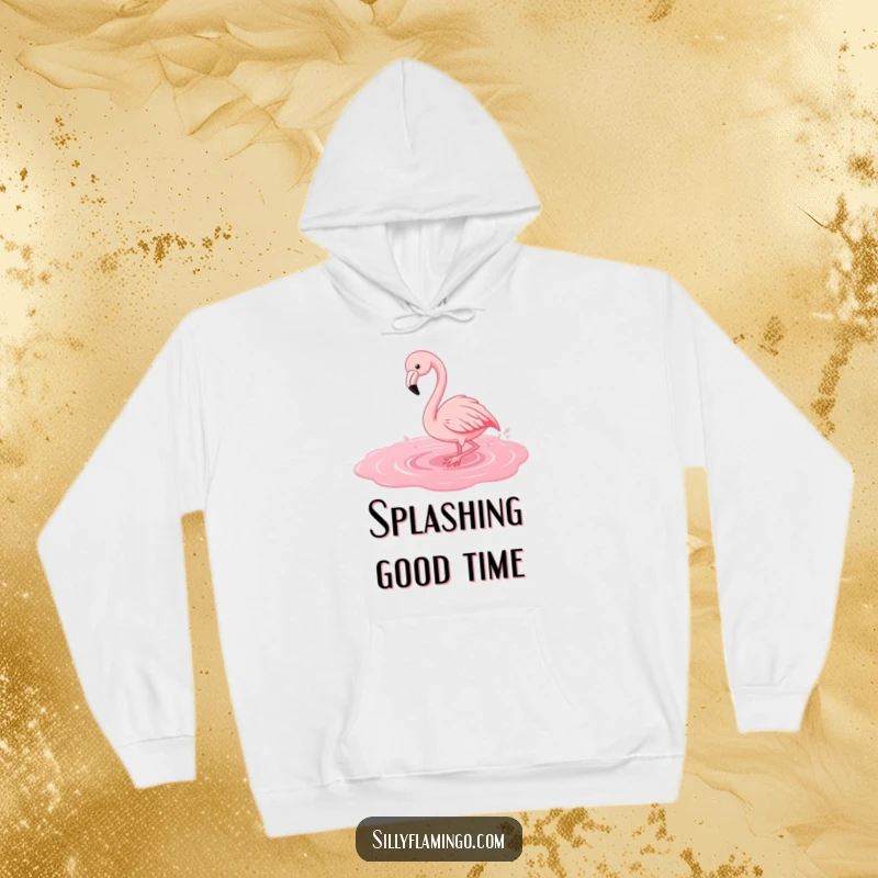 Funny flamingo hoodie graphic of a happy bird splashing exuberantly in a pink puddle, offering warmth and joy.
