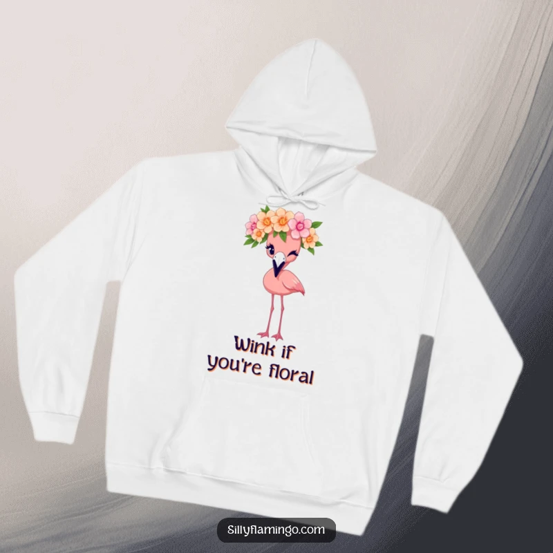 Funny flamingo hoodie adorned with a bird wearing a flower crown and winking, offering cozy style and charm.