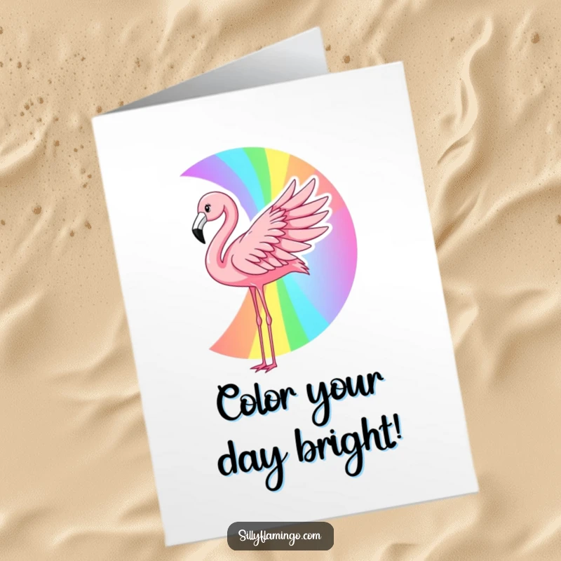 Funny Free Printable Birthday Card: A flamingo creates a vibrant rainbow with its wing, celebrating a birthday.