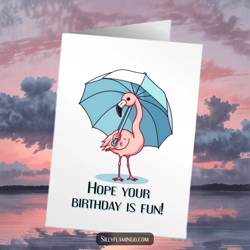 Funny Free Printable Birthday Card: A kawaii flamingo comically struggling to balance an open umbrella with its beak and feet.