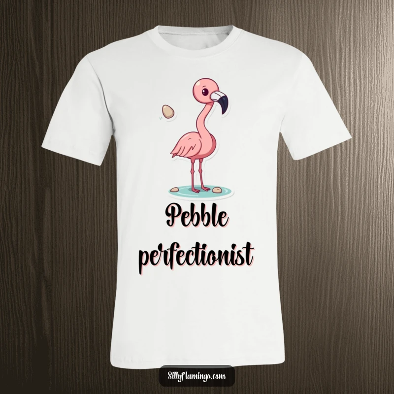 Funny flamingo t-shirt, actively tossing a shiny pebble with its beak, depicting a moment of quirky bird fun, perfect for casual wear and gifts.