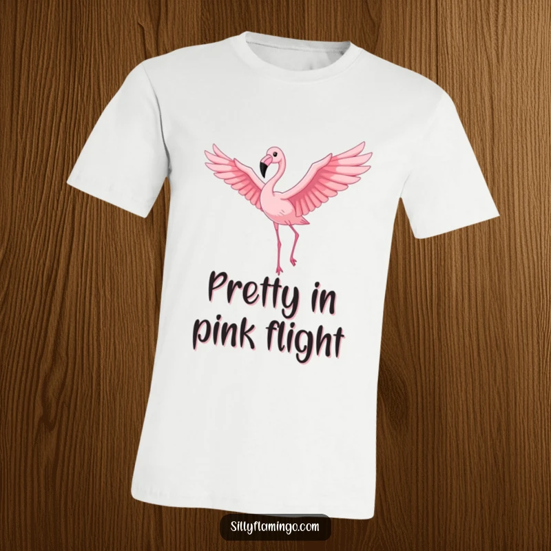 Funny Flamingo T-Shirt: A proud flamingo with outstretched wings gracefully soaring through a vivid pink sky, celebrating freedom and fun.