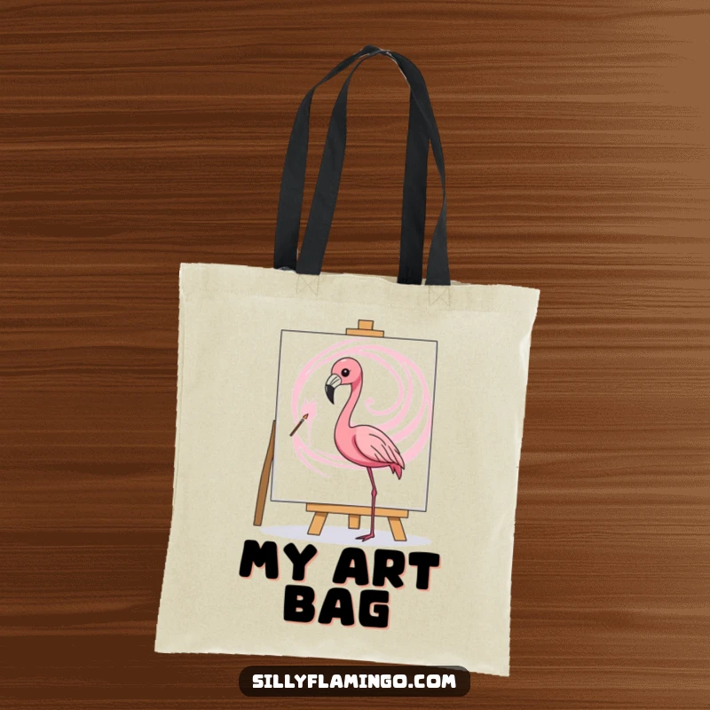Funny tote bag featuring a flamingo artistically painting a pink swirl on a canvas, practical for art supplies.