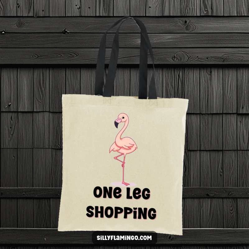 Funny Tote Bag featuring an elegant flamingo standing on one leg with a cheerful expression, perfect for carrying essentials.
