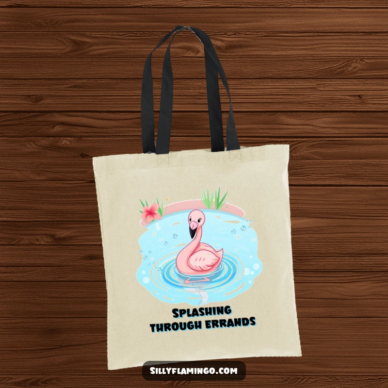 Funny flamingo tote bag depicting a pink bird joyfully splashing in a sparkling blue pond, bringing a tropical feel.
