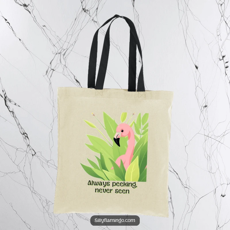 Funny tote bag with a charming flamingo peeking from lush green foliage, ideal for stylish and humorous errands.